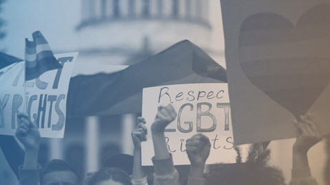 A group of protestors holding signs
